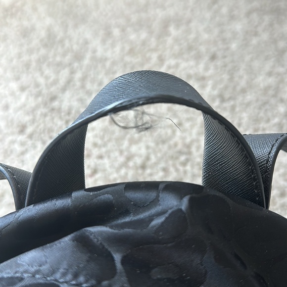 Used Michael Kors black canvas backpack. Black with black leopard spots. - Picture 4 of 5